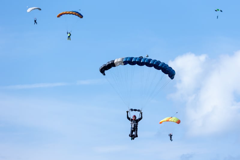 Skydivers glide towards drop zone on Friday, Aug 22, 2025 above Skydive Chicago in Ottawa.