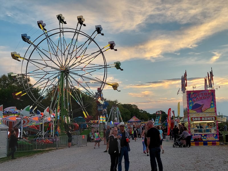 A ferris wheel towers over the carnival Saturday, Sept. 23, 2023, during the Shipyard Days festival in Seneca.