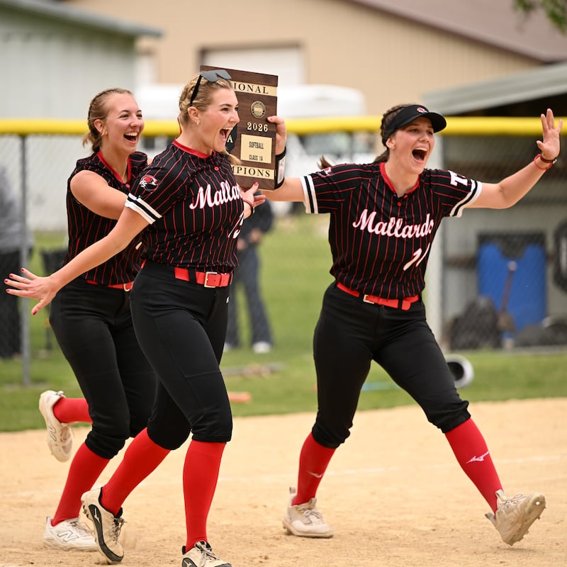 Henry-Senachwine's (from left) Rachel Eckert, Brooklynn Thompson and Harper Schrock celebrate after the Mallards beat Midland 3-1 in the Class 1A Henry-Senachwine Regional championship on Friday, May 22, 2026.