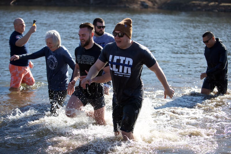 Locals take the plunge at the St. Charles Police and Fire Annual Polar Plunge at Ferson Creek Park on Sunday, March 9,2025 in St. Charles.