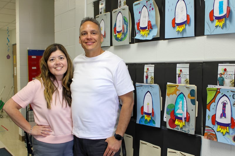 Creekside Elementary School reading specialist Sandy Figueroa and Juan Figueroa, third-grade dual language teacher, stand outside Juan’s classroom on Tuesday, April 8, 2025.
