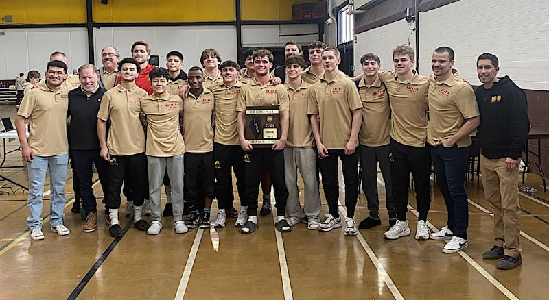 Batavia's wrestling team poses with its championship plaque at the Class 2A Morris Regional.