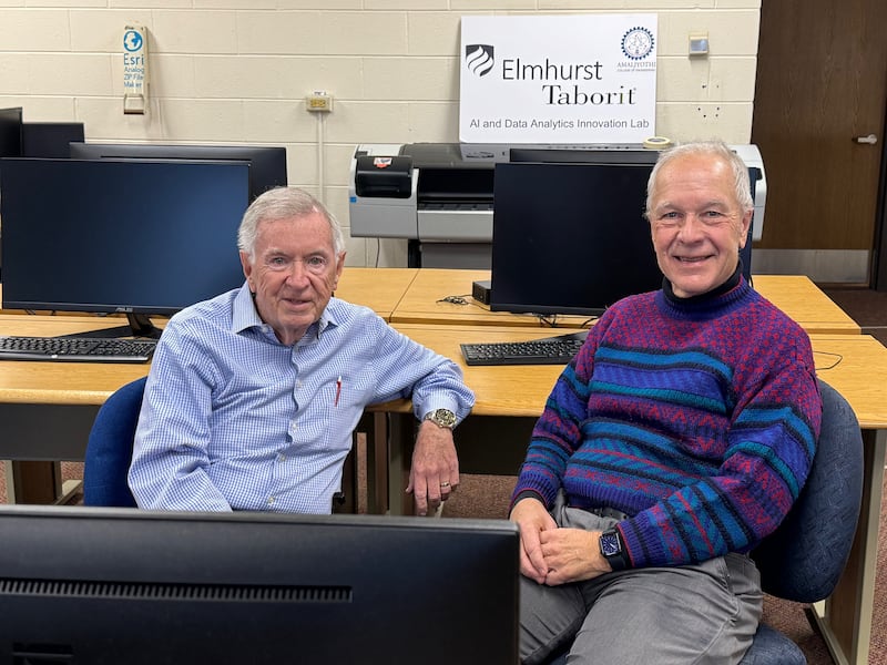 Patrick Yanahan (left), a member of American Legion Post 80 in Downers Grove, turned to Elmhurst University professor Jim Kulich to create an AI tool to help veterans identify resources.