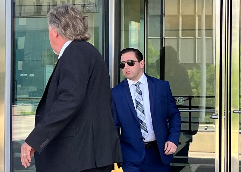 Timothy Pawula, 32, (right), with his attorney, Doug DeBoer, on Wednesday, June 5, as they leave the Will County Courthouse in Joliet.