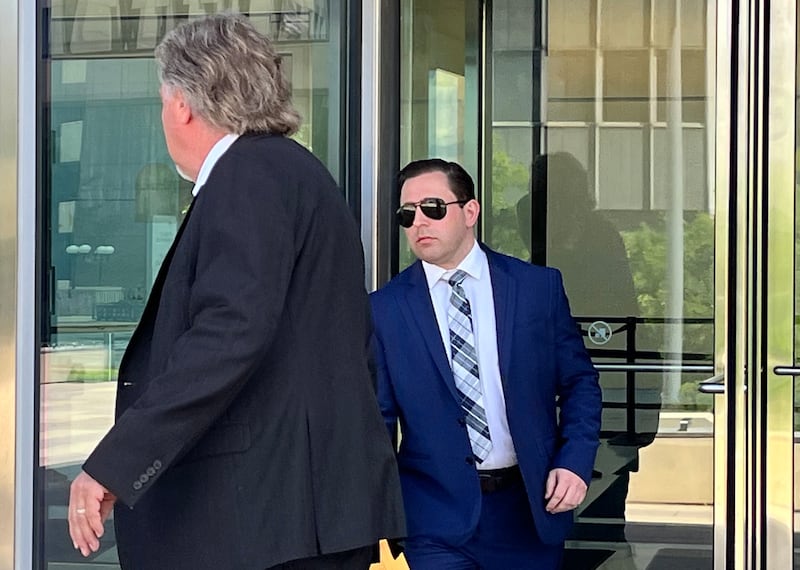 Timothy Pawula, 32, (right), with his attorney, Doug DeBoer, on Wednesday, June 5, as they leave the Will County Courthouse in Joliet.