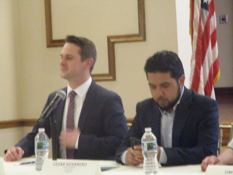Joliet Township supervisor candidates Darrell Boisdorf (left) and Cesar Guerrero await the start of a candidates' forum on Thursday in Joliet. March 19, 2025