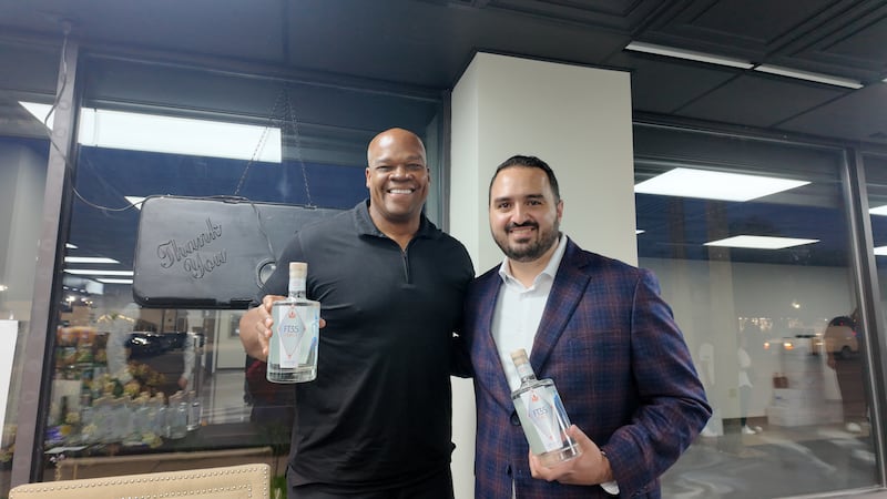 National Baseball Hall of Famer Frank Thomas (left) – also known as the “Big Hurt” – appeared at Goodfellas Cigar Lounge in Joliet Thursday night to sign bottles of his FT35 brand of spirits and chat with attendees. Thomas is seen with  Ammar Sheikah (right), co-owner of Goodfellas Cigar Lounge.