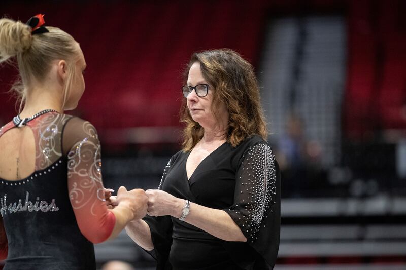 NIU coach Nita Teague talks to a gymnast during a meet last year. Teague was named the team's permanent head coach on Tuesday, July 8, 2025 after spending almost a year as the interim coach.