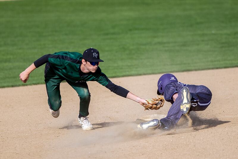Rock Falls’ Connor Fritz tags out Dixon’s James Simpson who rounded second base too far Tuesday, April 29, 2025.