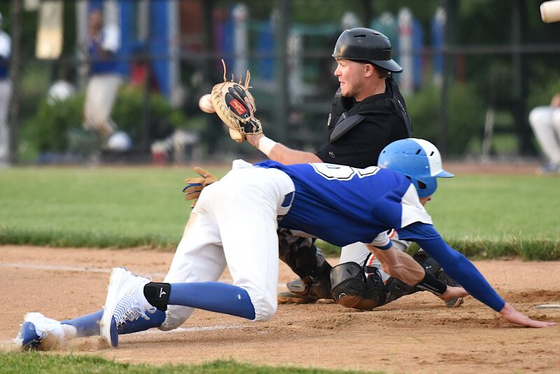 Beecher Muskies' Andrew Olszewski, front, dives into home plate as Lombard Orioles catcher Aaron Holland fields a throw during a Chicago Suburban Baseball League game at Gouwens Park in South Holland Wednesday, June 25, 2025.