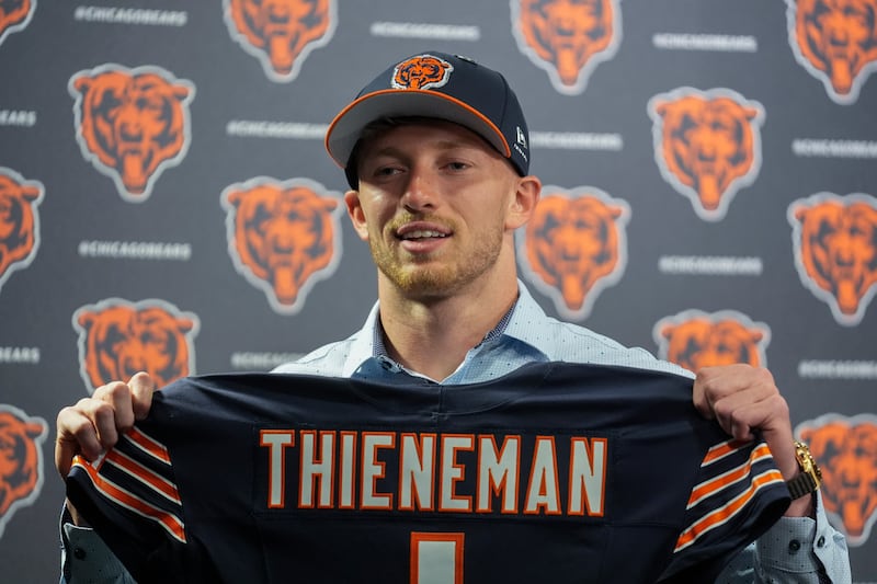 Chicago Bears first-round draft pick Dillon Thieneman holds his jersey during an NFL football news conference Friday, April 24, 2026, at Halas Hall in Lake Forest, Ill. (AP Photo/Erin Hooley)