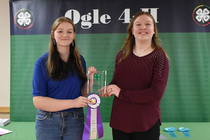 Ambassador Allissa Martin hands Mackenzie Taylor her Grand Champion ribbon and plaque sponsored by Julie Merdian.