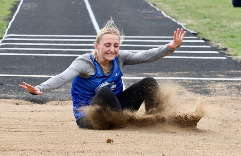 Princeton senior Ashlynn Weber lands with a winning jump in Thursday's Howard-Monier Invite. She won both the long jump and triple jump.