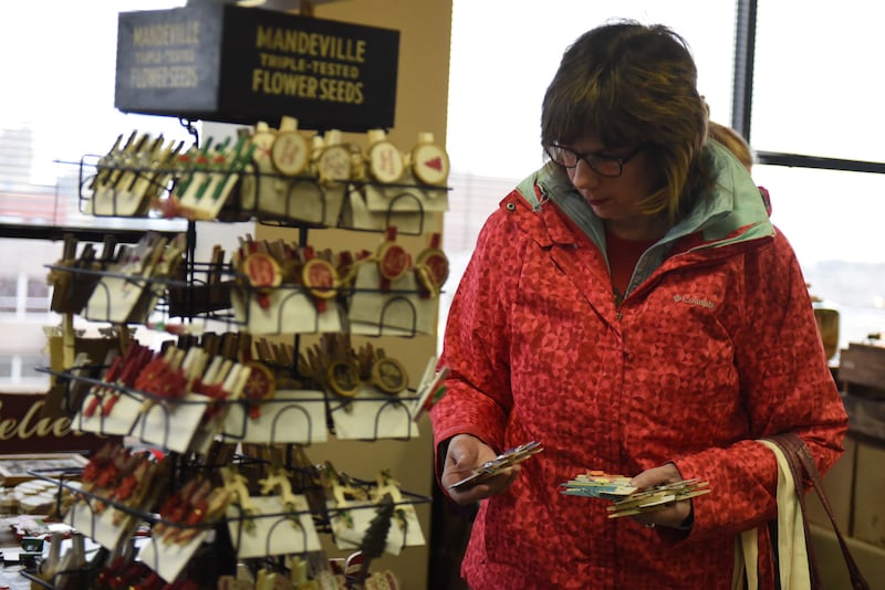 Ellen Stringer, of Bourbonnais, shops at a Winter Market held at the Kankakee Public Library.