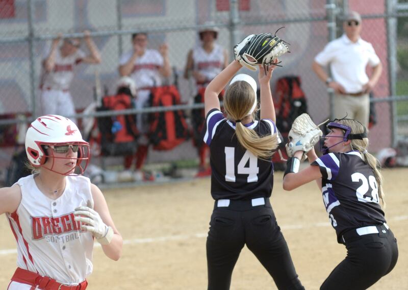 Dixon's Allie Abell and Kennedy Haenitsch almost collide when they both go after a pop fly against Oregon on Tuesday, May 7, 2025 at Oregon Park West.