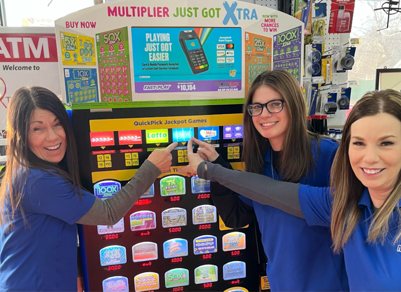 Josie (left), Heather and Kathy, employees at Chemung Country Store near Harvard, celebrated a $1.15 million lottery ticket winner.