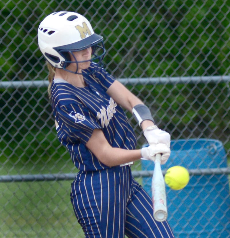 Marquette’s Avery Durdan connects for a base hit to drive in the Lady Crusaders first run against Elgin St Edward Wednesday at Serena.