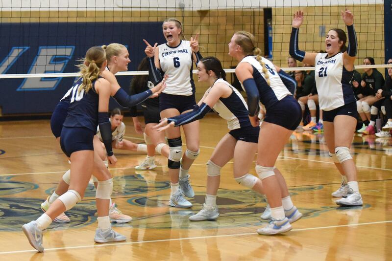 Members of the Cissna Park girls volleyball team celebrate a point during a home game against Bishop McNamara Wednesday, Oct. 15, 2025.