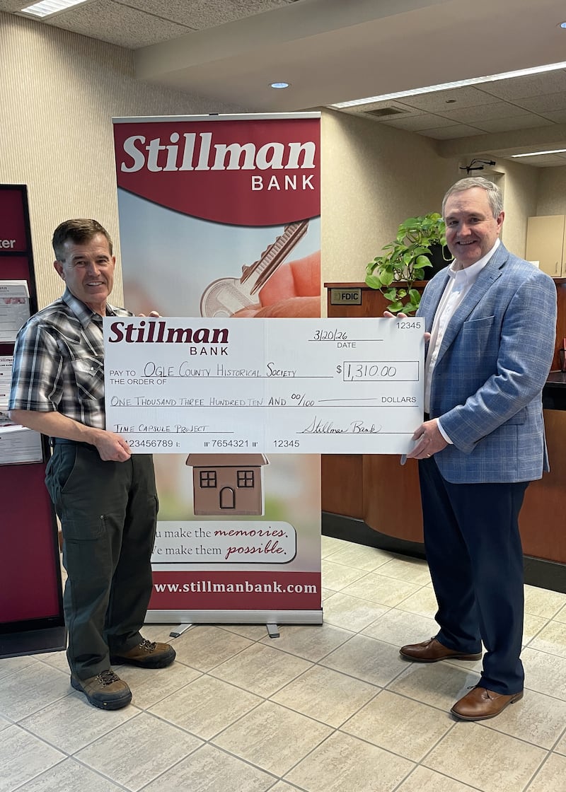 Pictured is Stillman Bank President & CEO Tom Hughes (right) presenting Ogle County Historical Society Board Member Tom Lichty (left) with a check for $1,310 to purchase one of the stainless-steel vaults needed for this project.