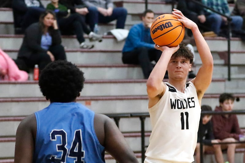 Prairie Ridge's Elijah Loeding shoots the ball over Illinois Math & Science Academy's Lota Onwuameze during a IHSA Class 3A Burlington Central Regional quarterfinal boys basketball game on Monday, feb23, 20256, at Prairie Ridge High School in Crystal Lake.