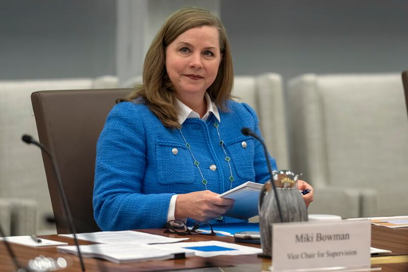 FILE - Michelle Bowman, Vice Chair for Supervision of the Federal Reserve Board of Governors, takes a seat for an open meeting of the Board of Governors at the Federal Reserve, in Washington, June 25, 2025. (AP Photo/Mark Schiefelbein, File)