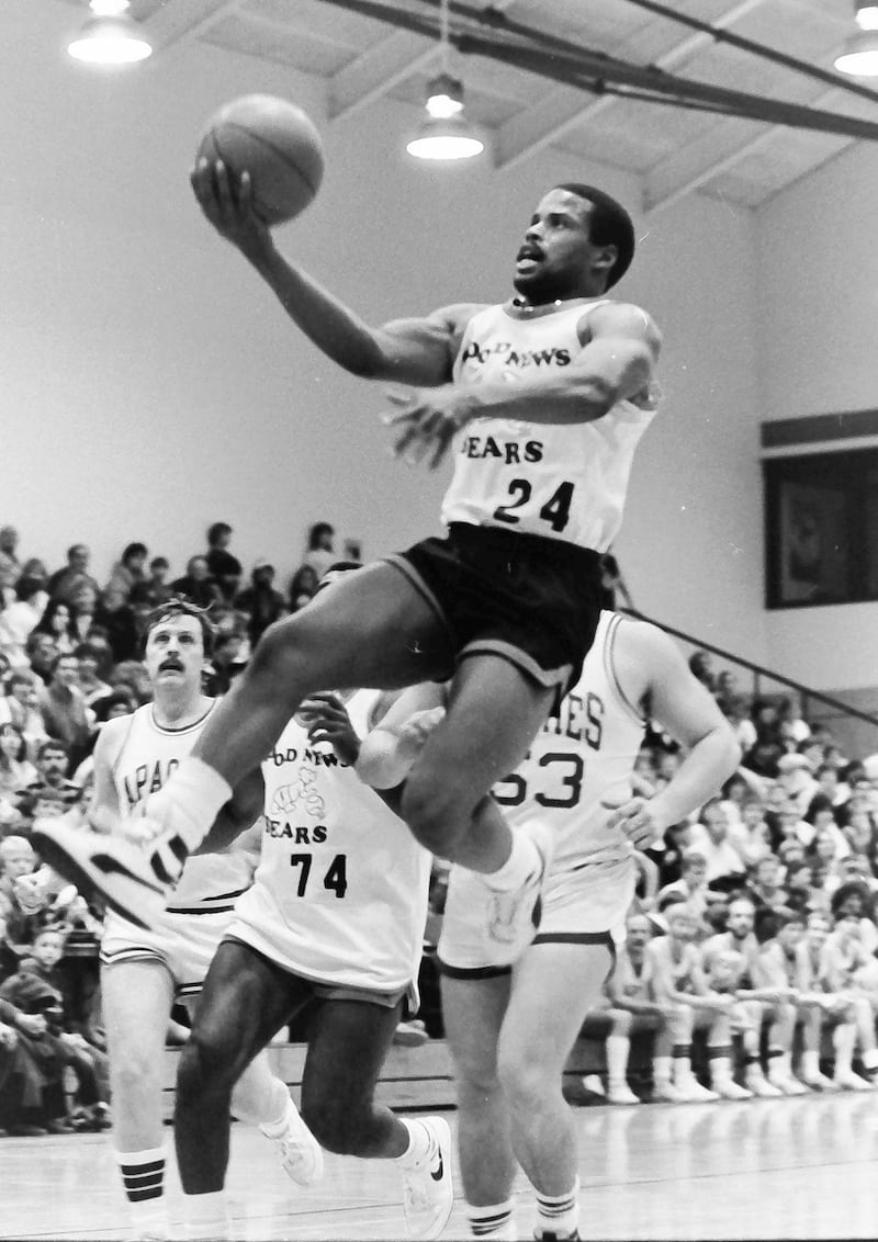Chicago Bears safety Shaun Gayle runs in for a layup against IVCC during the Good News Bears game on Thursday, Feb. 20, 1986 at Illinois Valley Community College in Oglesby.