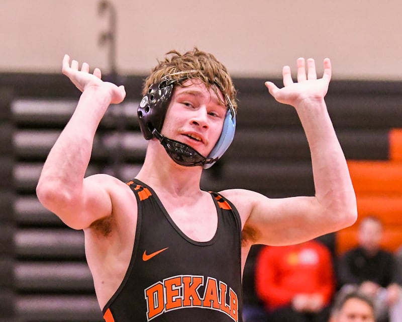 DeKalb’s Ayden Shuey celebrates his first place finish in the 132-weight class during the regional title match on Saturday Jan. 31, 2026, held at DeKalb High School.