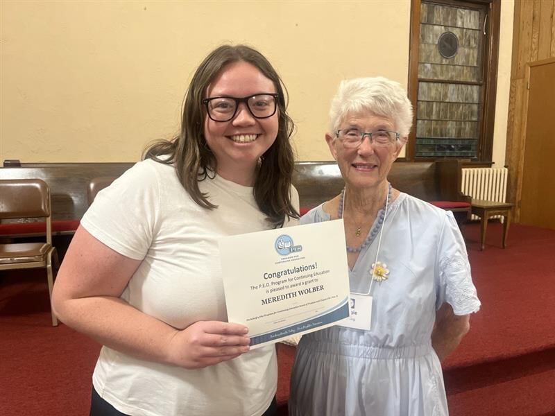 Meredith Wolber receiving her PCE certificate presented by Maggie Henning, PCE chair.