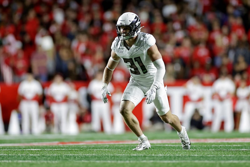 Oregon defensive back Dillon Thieneman (31) defends during the first half of an NCAA college football game against Rutgers, Saturday, Oct. 18, 2025, in Piscataway, N.J. (AP Photo/Adam Hunger)