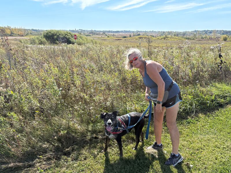 Terri Kearnes, of McHenry, walks the Stickney Run Conservation Area on Sunday, Oct. 5, 2025, with her dog. She began volunteering with the district's SWEEPS program in October 2024 as she was walking the trails with her dogs anyway.
