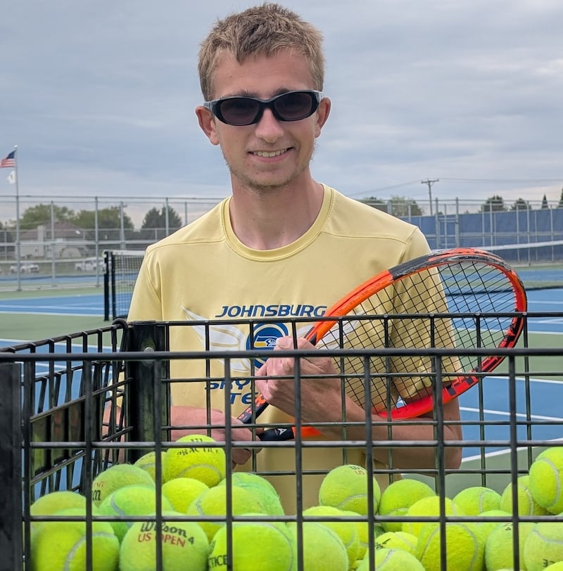 Johnsburg's Tyler Batt poses for a picture on his home tennis court Saturday, May 9, 2026, in Johnsburg. The senior is closing in on 100 career wins, which would be in first in program history.