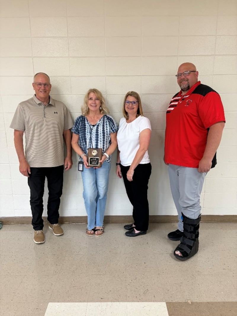 Board of Education President Chip Braker, Teacher of the Year Darlene Griseta, Superintendent Sheri Smith and Forreston Junior Senior High School Principal Travis Heinz.