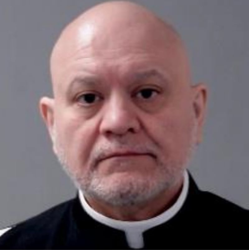 The Rev. Carlos Martins' booking photo from the Joliet Police Department.