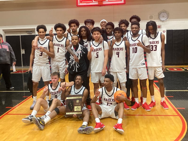 The Bolingbrook boys basketball team poses with its freshly won regional title plaque Friday, Feb. 28, 2025.