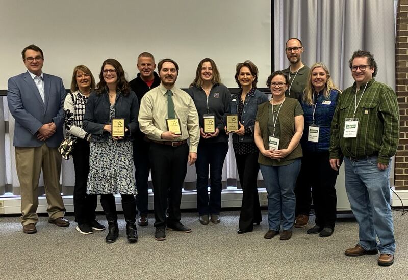 DeKalb Mayor Cohen Barnes (fourth from left), Second Ward Alderwoman Barb Larson (second from left) and members of the Citizens’ Environmental Commission gather with recipients of the DeKalb STARR Award, presented April 5, 2025, at DeKalb County Earth Fest.