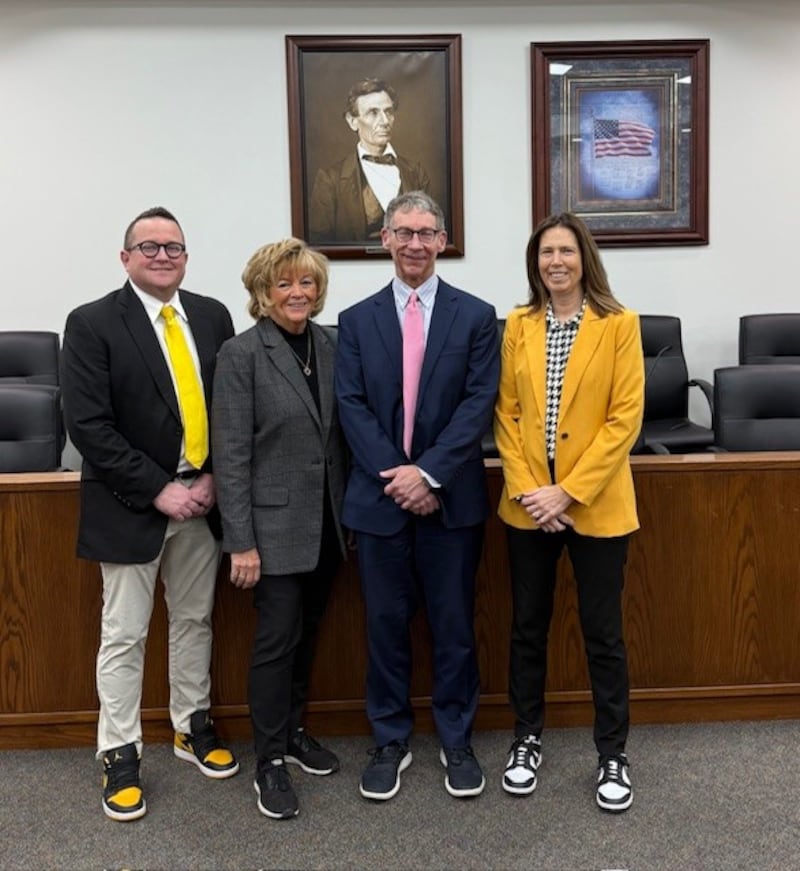 (From left) Lee County Circuit Judge Matthew Klahn, Judge Theresa Friel-Draper, Judge Douglas Lee and Chief Judge Jacquelyn Ackert paid $5 for each day they wore sneakers to work in February to collect money for pediatric cancer research.