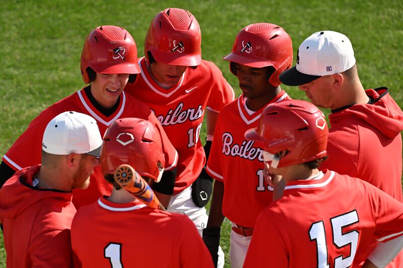 Coaches and players for BBCHS strategize during the game on Thursday, May 8th, 2025.
