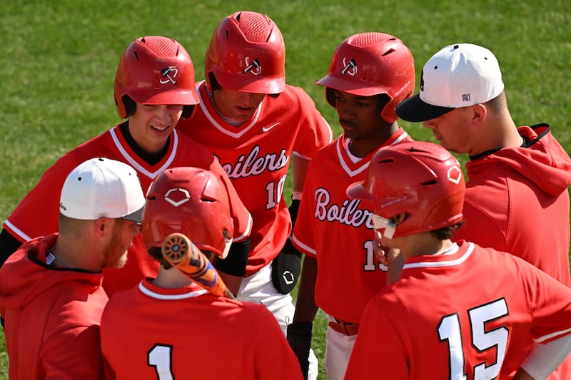Coaches and players for BBCHS strategize during the game on Thursday, May 8th, 2025.
