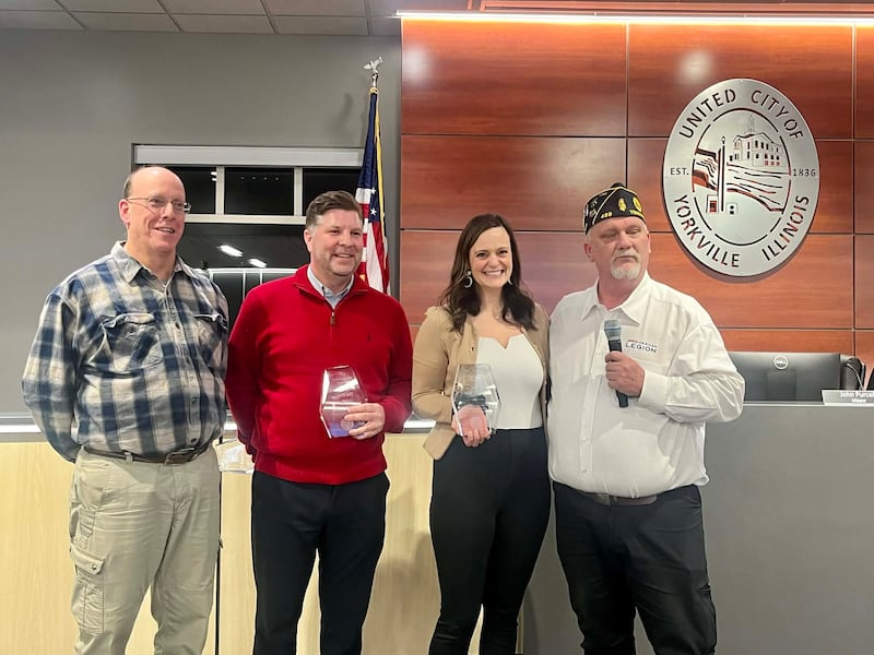 Jeff Sanders (far right), post commander for the Yorkville American Legion, presented plaques of appreciation to Tim Evans (second left), superintendent of parks Scott Sleezer (not pictured), and superintendent of recreation Shay Remus (second right).