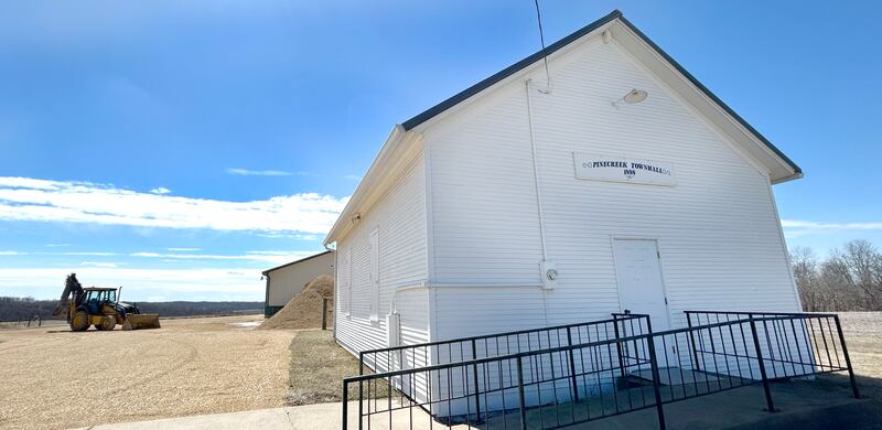 The Pine Creek Town Hall, constructed in 1898, is located on Pines Road between Oregon and Polo. It is where Pine Creek Township voters cast their ballots. In the background is some of the equipment and garage used by the township to maintain and plow township roads.