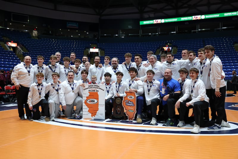 Marmion Academy poses with the IHSA Class 3A Dual Team State championship trophy following their victory over Montini on Saturday, Feb. 28, 2026.