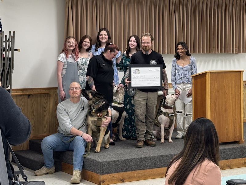 Representatives from K9s for Vets, and their dogs, with students from Gardner-South Wilmington High School during the Community Foundation of Grundy County's Young Philanthropy Banquet on Monday, May 11.