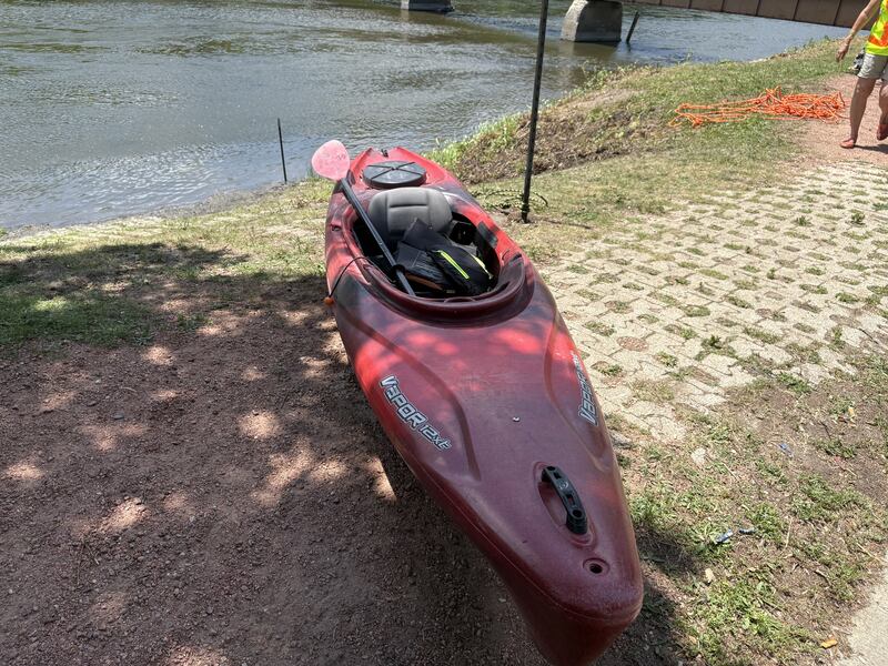 A kayak sits at the edge of the Fox River in East Dundee during the "El Cardunal" paddle June 22, 2025.