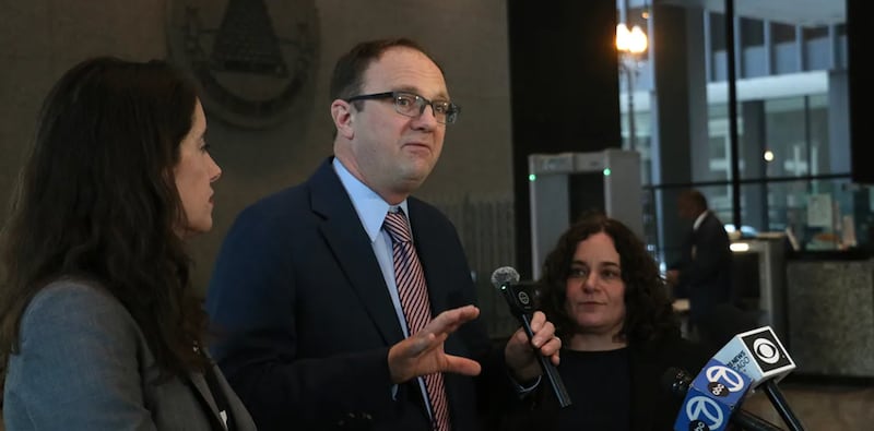 National Immigrant Justice Center attorneys Mark Fleming and Keren Zwick, right, and ACLU of Illinois attorney Michelle Garcia speak to reporters at the Dirksen Federal Courthouse in downtown Chicago after a Feb. 13, 2026 hearing on warrantless immigration arrests amid Operation Midway Blitz.
