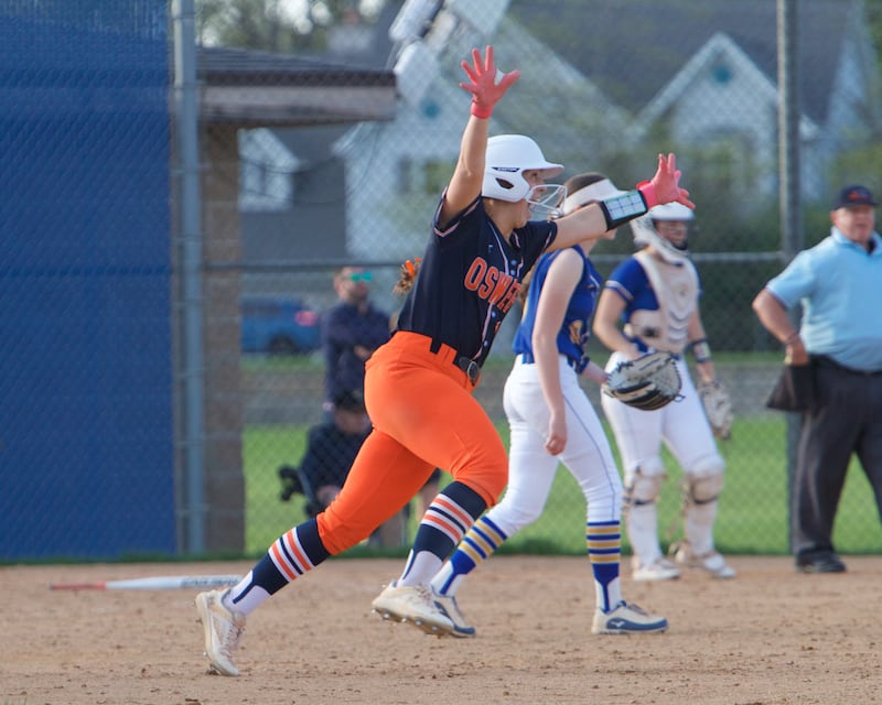 Oswego's Rikka Ludvigson celebrates hitting a homer in the top of the seventh inning against Wheaton North on Tuesday May 6, 2025 in Wheaton.