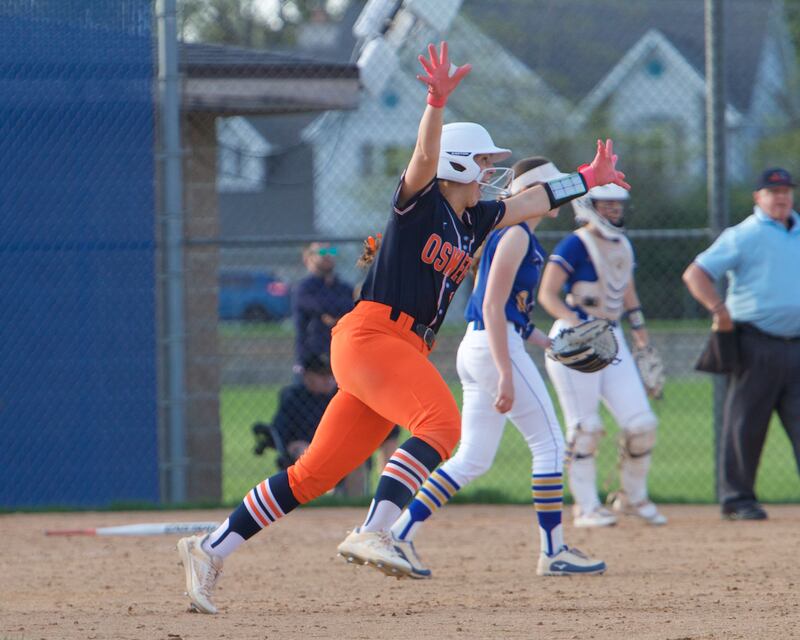 Oswego's Rikka Ludvigson celebrates hitting a homer in the top of the seventh inning against Wheaton North on Tuesday May 6, 2025 in Wheaton.