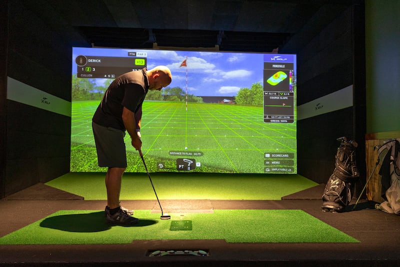 Derick Cox of Rock Falls putts Thursday, August 7, 2025, at X-Golf Sauk Valley.