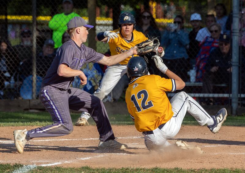 Sterling’s Drew Nettleton steals home to take the lead over Dixon in the top of the 7th Friday, May 23, 2025.