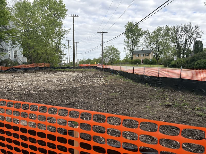 Orange fencing surrounds a demolished property along Route 47 in Woodstock May 22, 2025.