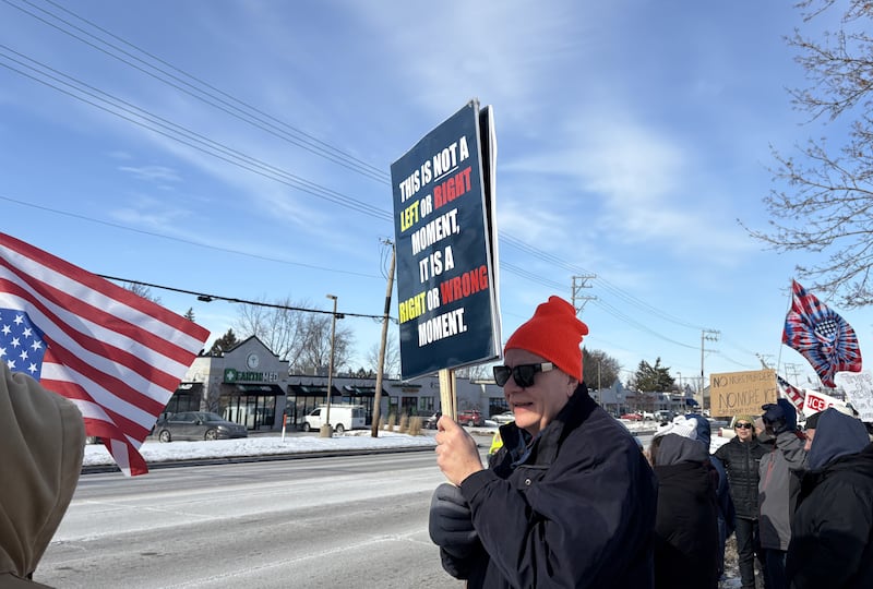 Ralph Iden holds a sign at a protest in McHenry Feb. 1, 2026.